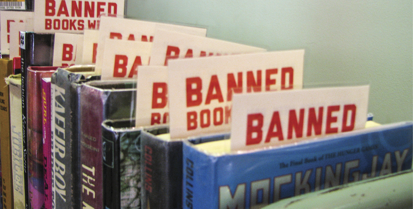 boos sitting on shelf with slips sticking out that say