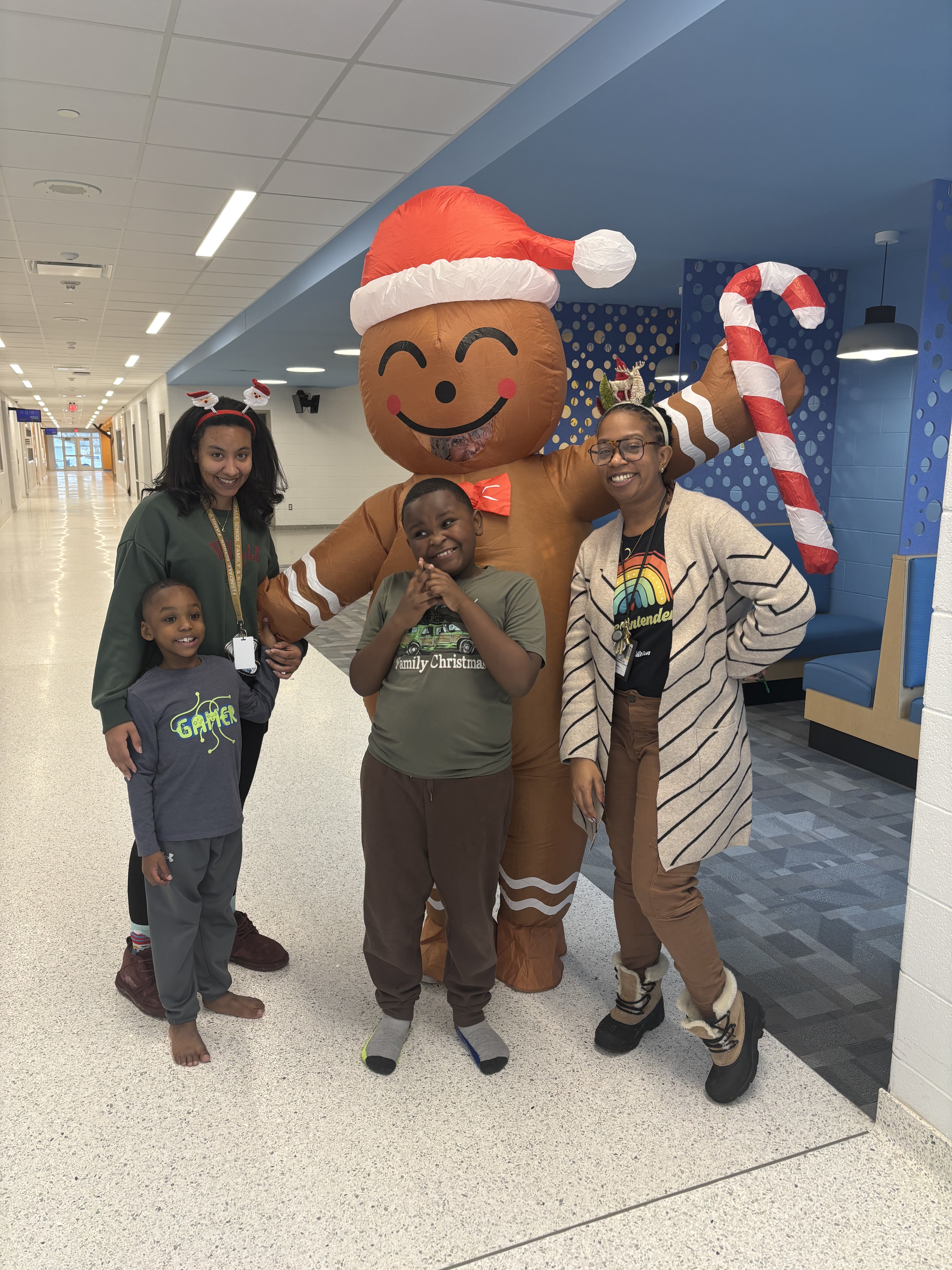 Superintendent Camille Hibbler (far left) with staff and students at Ferndale's joyful holiday event.