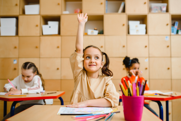 child raising hand