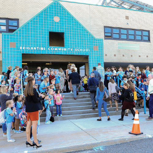 Children and adults entering a school
