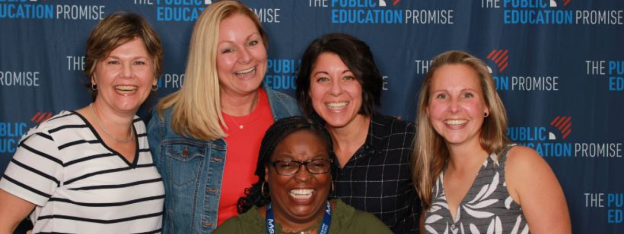 EPIC attendees with PEP backdrop