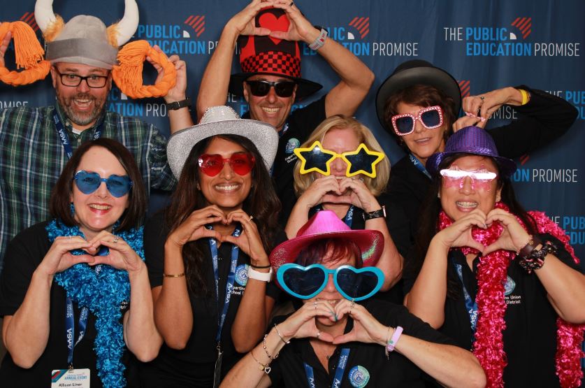 Attendees enjoying the photo booth at EPIC