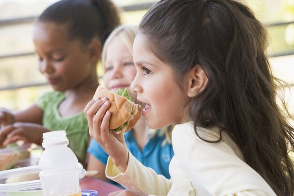 Kid eating sandwich