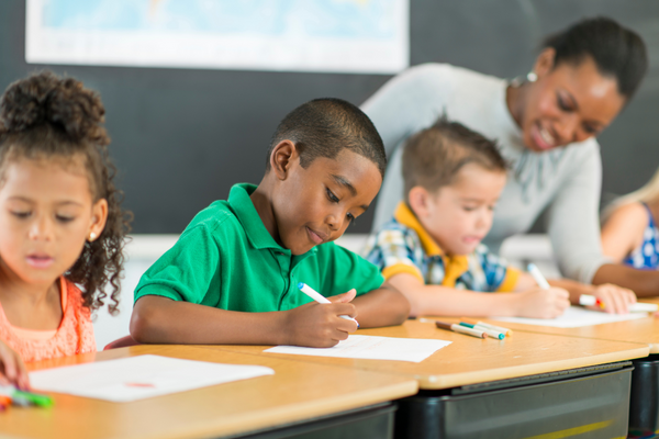 Teacher and students at desks