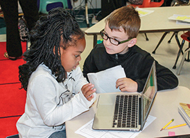 3/4 grade students working on laptop