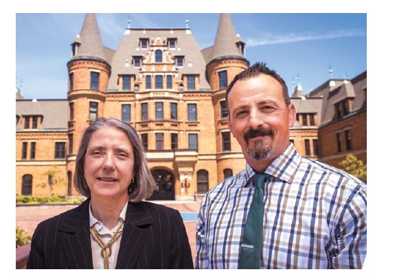 Toni Pace and Joshua Garcia outside of a historic building