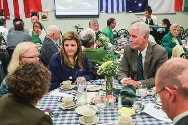 Chuck Dedrick at a dinner table