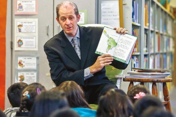 Devin Vodicka reading to students