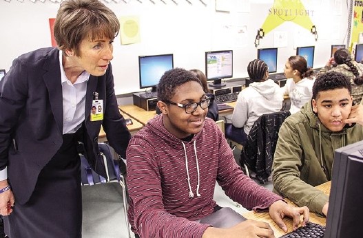 Kimberly Hill watching students code a game