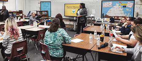 Devery Rodgers, rear, leading a session on digital citizenship for parent liaisons in the San Juan Unified Schools in Sacramento, Calif.