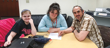 Eric J. Hartz, director of Campus Connect in the Madison, Wis., Metropolitan School District, with two participating students.