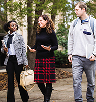 Laurie Kimbrel (center), a former superintendent, with students on campus at the University of West Georgia, where she now teaches.