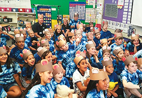 San Juan, Calif., Unified School District Superintendent Kent Kern sits in the rear of a classroom with kindergarteners at Northridge Elementary School to celebrate National Teddy Bear Day.