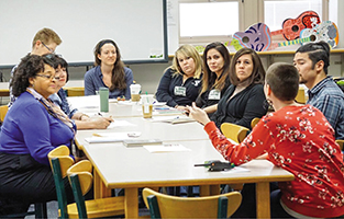 Allison Horton (front), restorative practices coordinator at Skinner Middle School in Denver, with educators from across Colorado who are looking to build restorative cultures in their own schools.