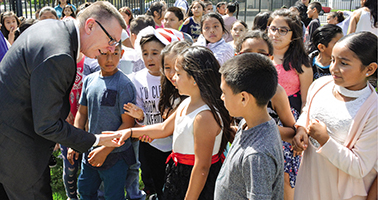 John Deasy (left), superintendent in Stockton, Calif., greeted students on his first day in office, which was the final day of the 2017-18 school year.