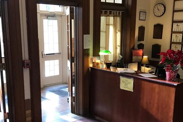 An interior office pictured towards the front entrance of a school
