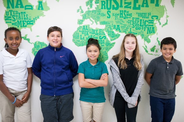 Give students pose in front of an artist rendering of the world