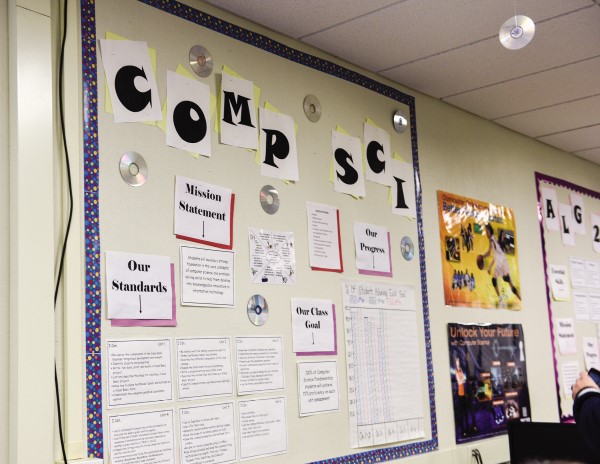 A bulleting board with mission statements and standards