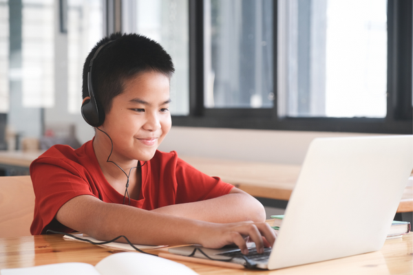 Kid on Laptop with Headphones