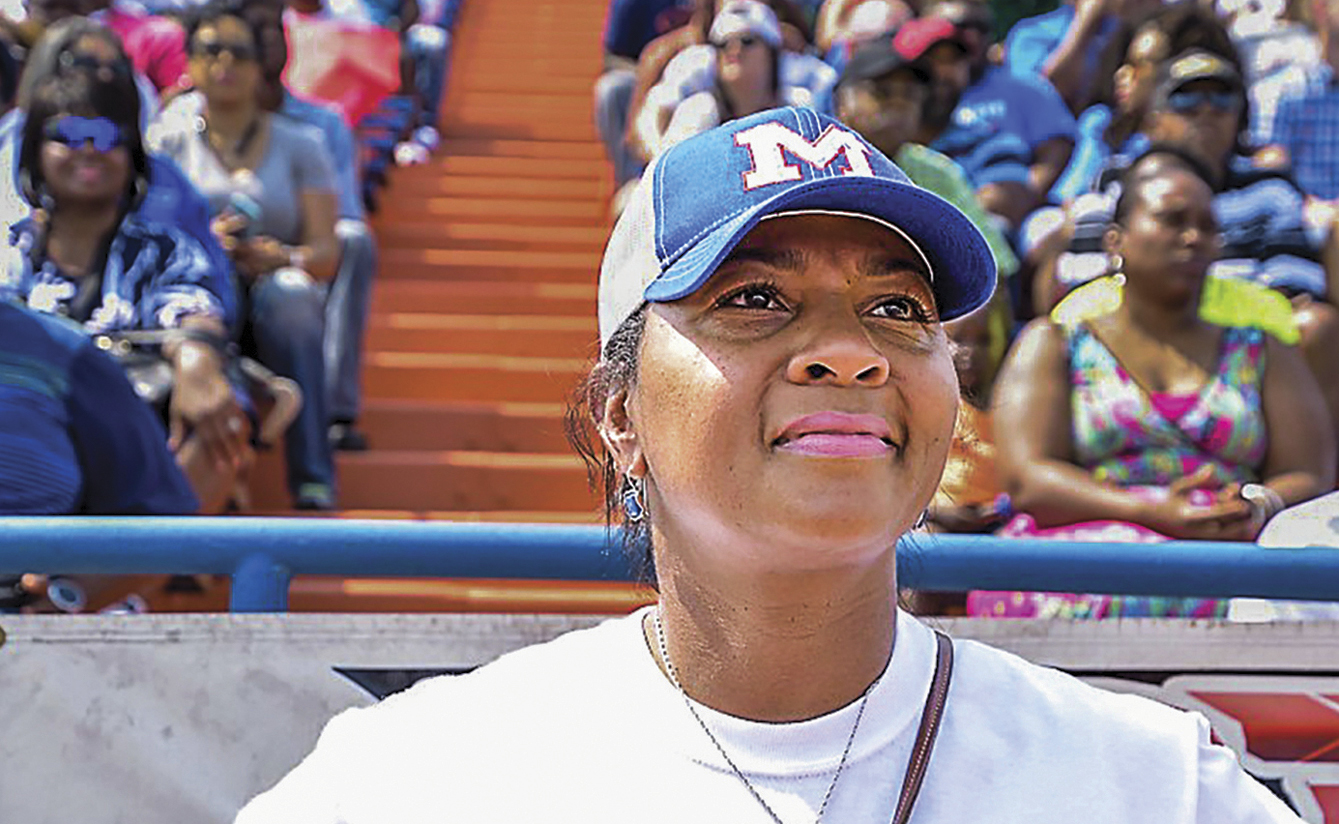 Cecilia Robinson-Woods in front of stands