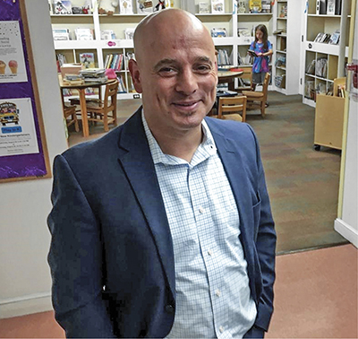 Aaron Polansky in blue suit jacket
