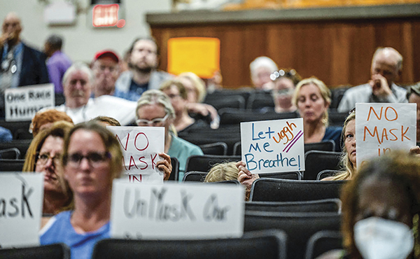 People protesting at school board meetings