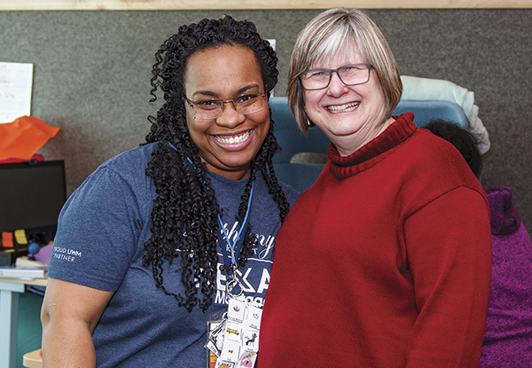 Two women smiling at camera