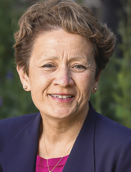 Karen Rezach in pink blouse and dark blue blazer