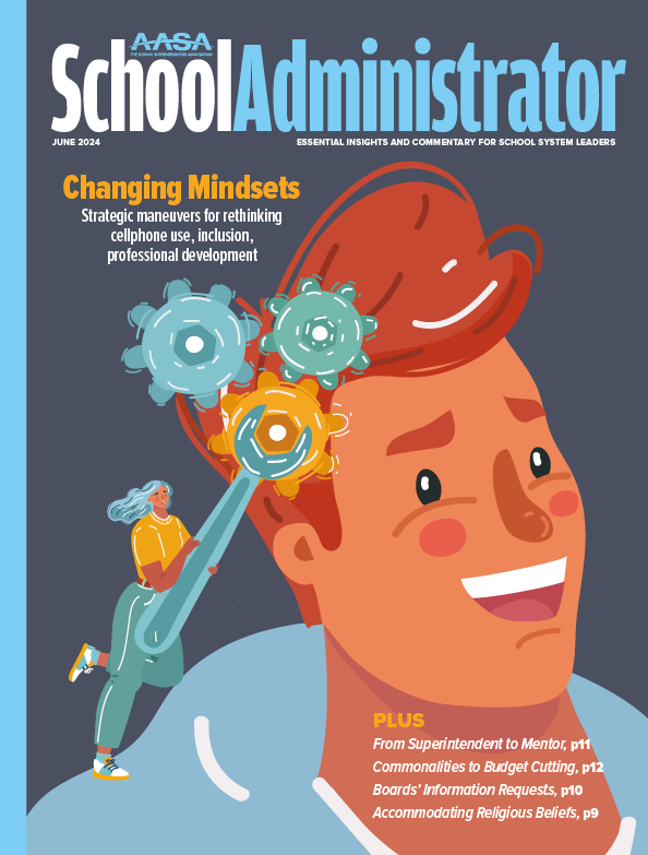 June magazine cover is dark blue and light blue with an illustration of a red-headed man with cogs in his brain being adjusted by another person