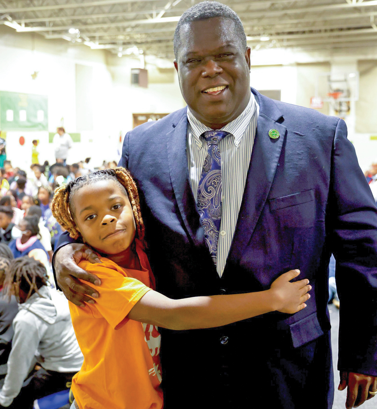 Frederick Williams gets a hug from a student