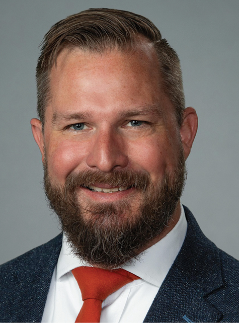 White brunette man smiling headshot