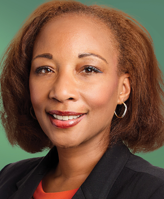 A Black woman in black suit headshot