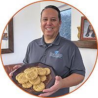 Gudiel Crosthwaite with a plate of cookies