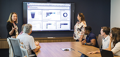 Pat Greco, left, former superintendent, giving a presentation