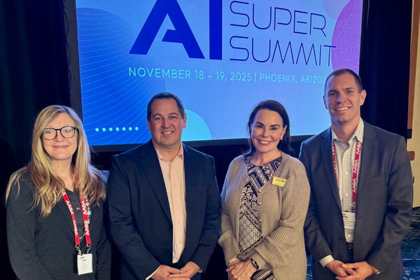Karen Cheser, Josh Swanson, Shannon King, and Robb Virgin group photo at the AI Super Summit.
