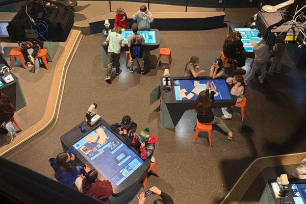 First one is an image of Great Falls Elementary Students participating in a field experience at Maine's Gulf Of Maine Research Center where students get to help scientists monitor life cycles of various sea creatures.