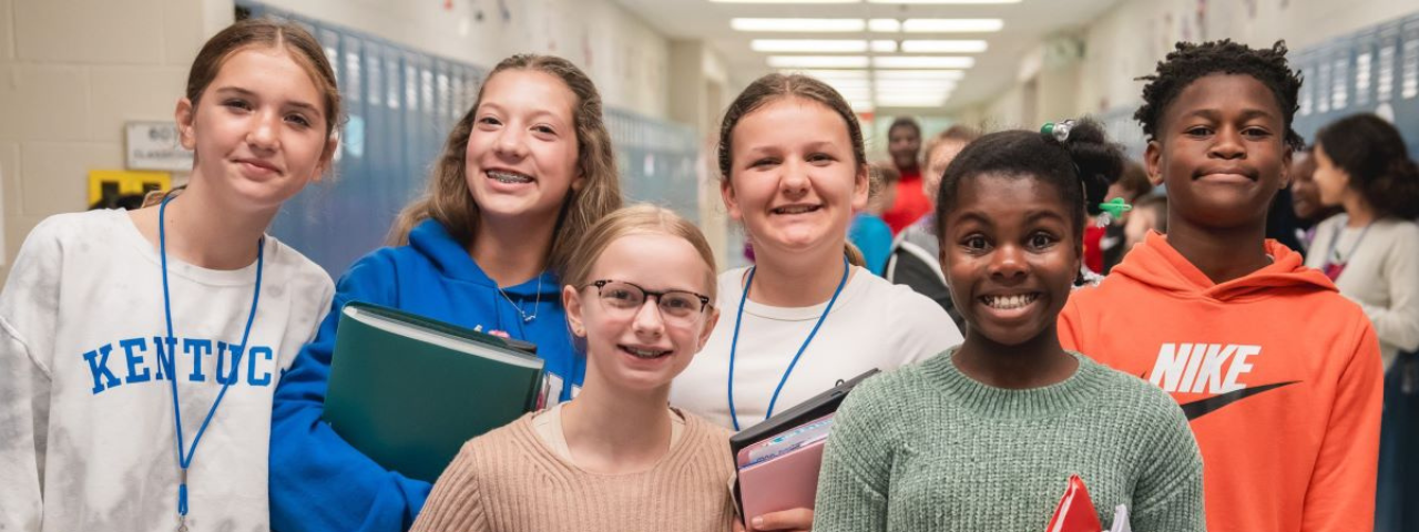 Smiling kids in hallway
