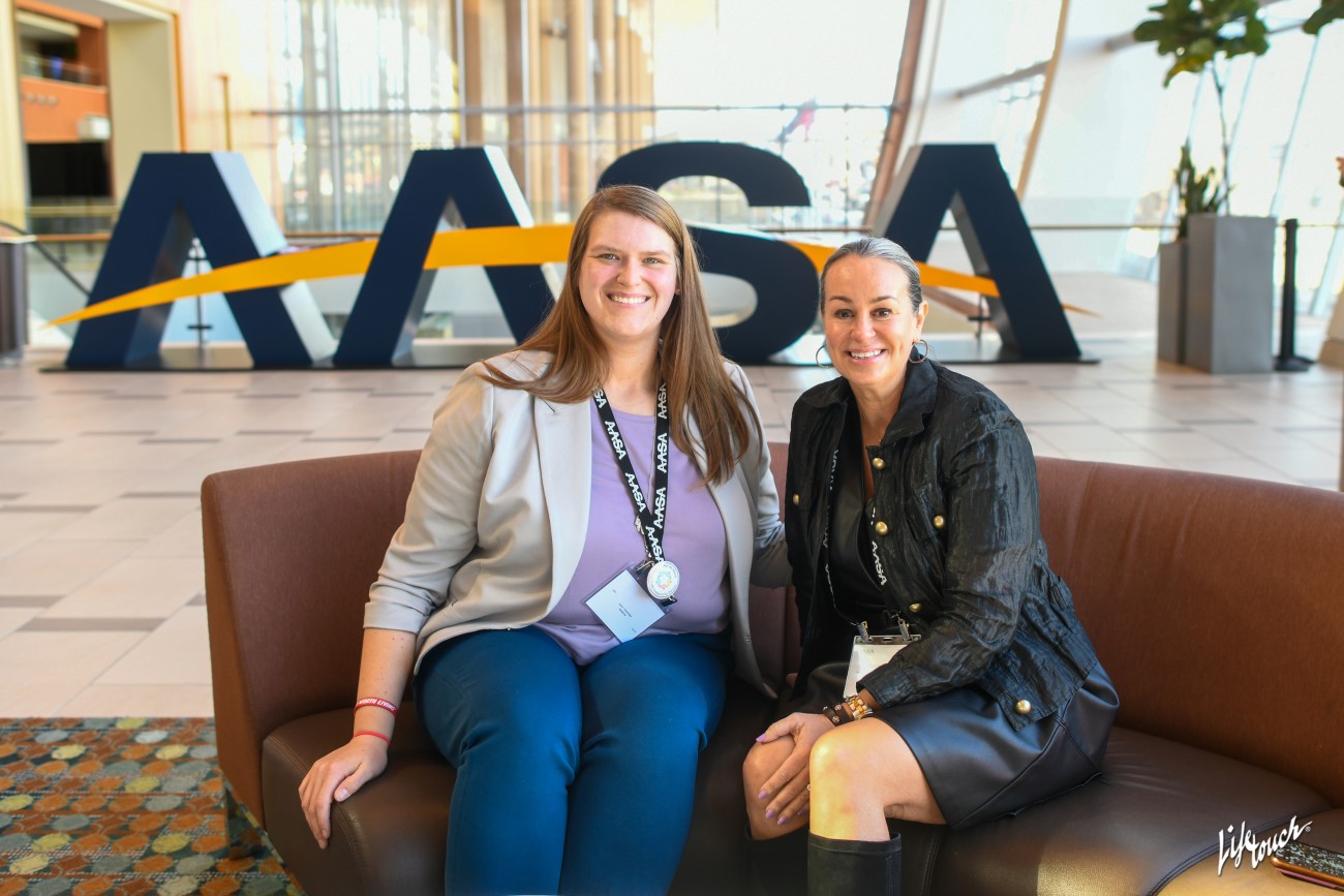 Women-AASA-Letters Women in front of large AASA letters