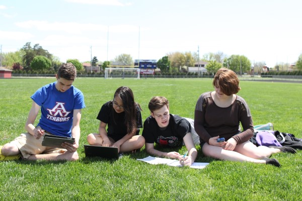 Students Working on Laptops Outside