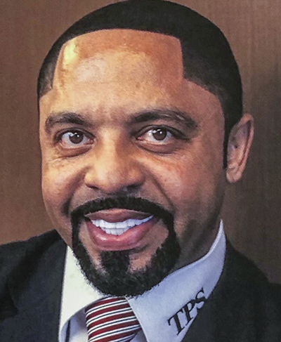 Headshot of Romules Durant, a Black man with short black hair and a goatee