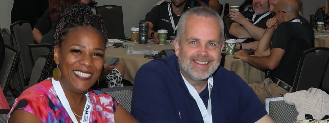 background-apps Two Attendees Smiling