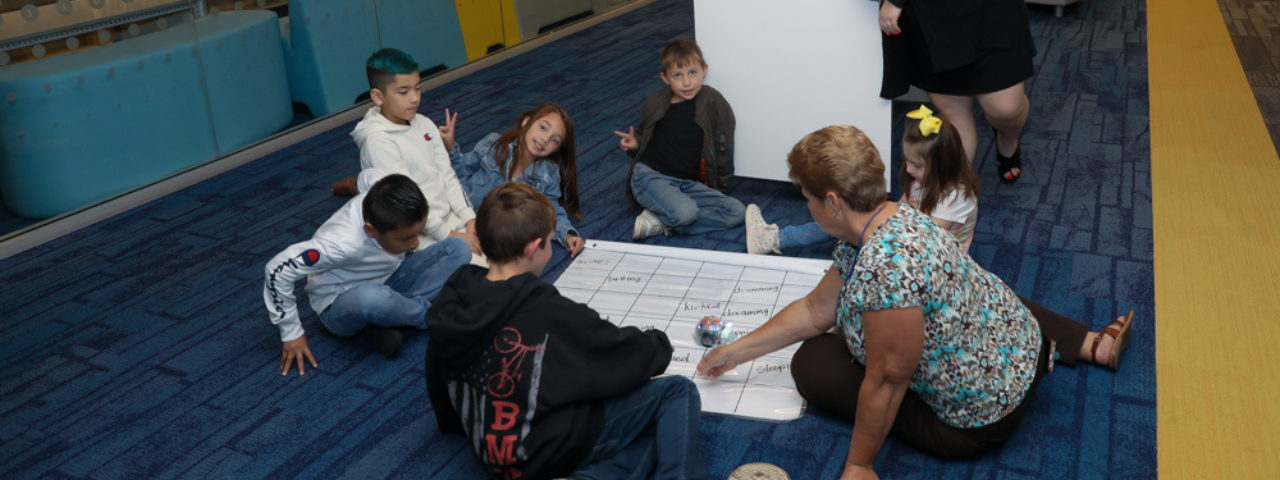 Kids floor students on the floor